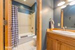 Shared Full Bathroom with Double Vanity & Tub/Shower Combo